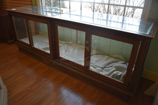 Wooden Dry Merchandiser Case w/ Glass Countertop and Doors. BUYER MUST REMOVE. 96.5x26.5x35.5. (garden center)