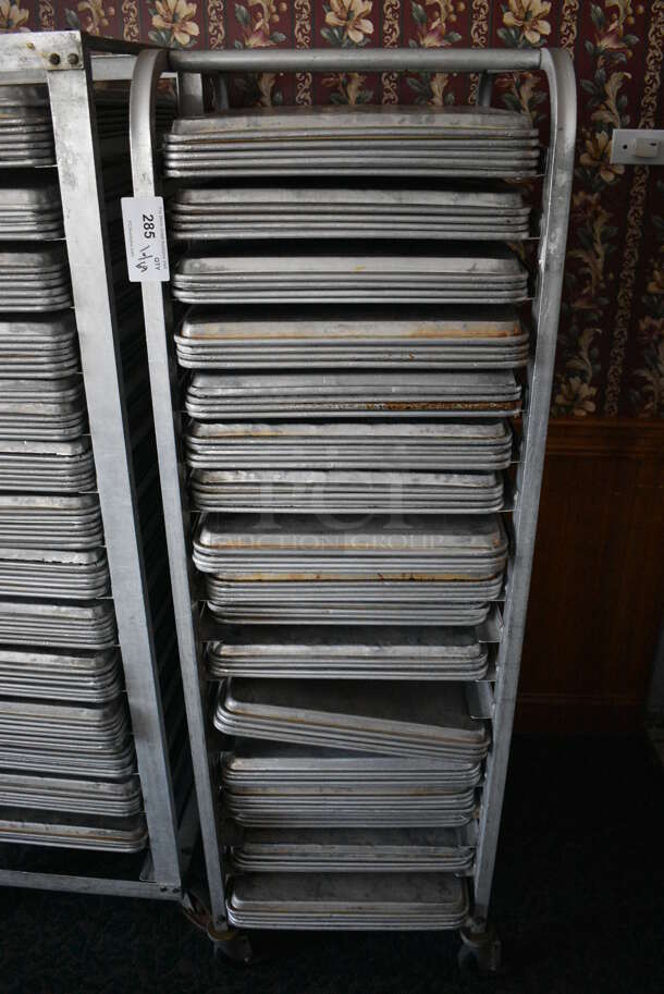 Metal Commercial Pan Transport Rack w/ 69 Metal Full Size Baking Pans on Commercial Casters. 20.5x28x65. 18x26x1. (sunroom dining room) - Image 1 of 5