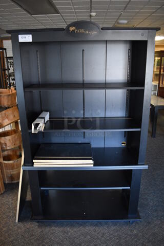 Black Shelving Unit. 46x20x77. (garden center)