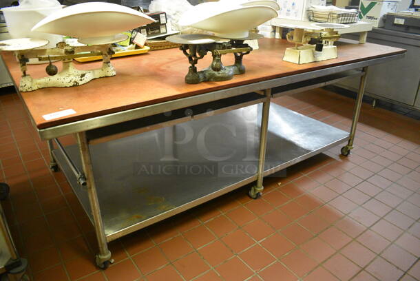 Stainless Steel Commercial Table w/ Cutting Board Tabletop and Under Shelf on Commercial Casters. 96x60x36.5. (bakery kitchen)
