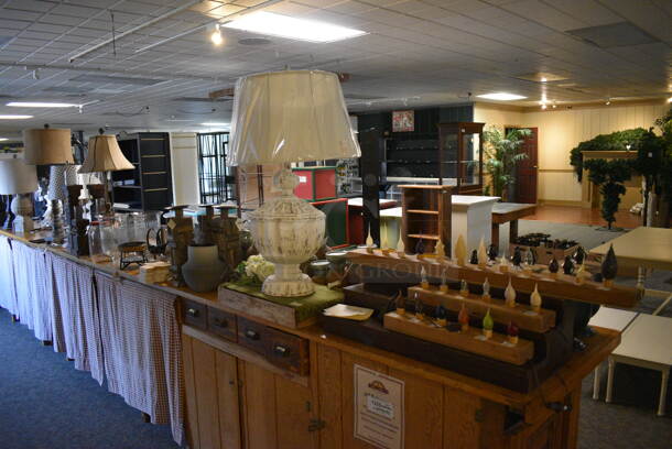 ALL ONE MONEY! Lot of Wooden Counter and Various Contents Including Lamps! BUYER MUST REMOVE. 235x28x36 (garden center) - Image 1 of 12