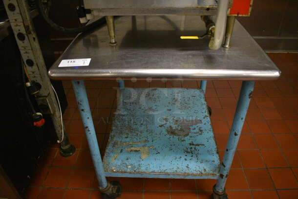 Stainless Steel Commercial Table w/ Metal Under Shelf on Commercial Casters. Does Not Include Contents. 30x36x35. (kitchen)