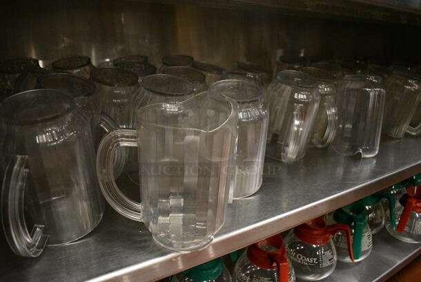 ALL ONE MONEY! Lot of 48 Clear Poly Pitchers! 7.5x5x8. (kitchen) - Image 1 of 3