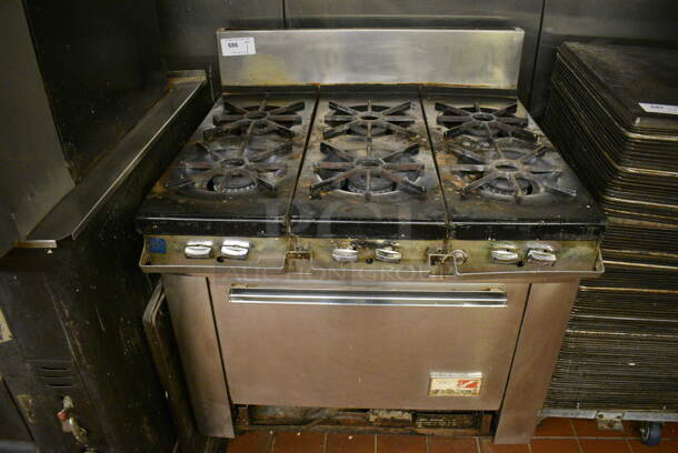 Southbend Stainless Steel Commercial Natural Gas Powered 6 Burner Range w/ Oven and Back Splash. 36x33x44. Unit Was In Working Condition When Restaurant Closed. (bakery kitchen)