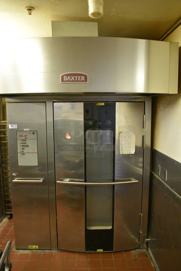 Baxter Stainless Steel Commercial Natural Gas Powered Floor Style Single Door Roll In Rotating Double Rack Oven w/ Attached Hood and 2 Metal Pan Racks. BUYER MUST REMOVE. 208-240 Volt, 3 Phase Controls. 73x97x99.5. Unit Was In Working Condition When Restaurant Closed. (bakery kitchen) - Image 2 of 8