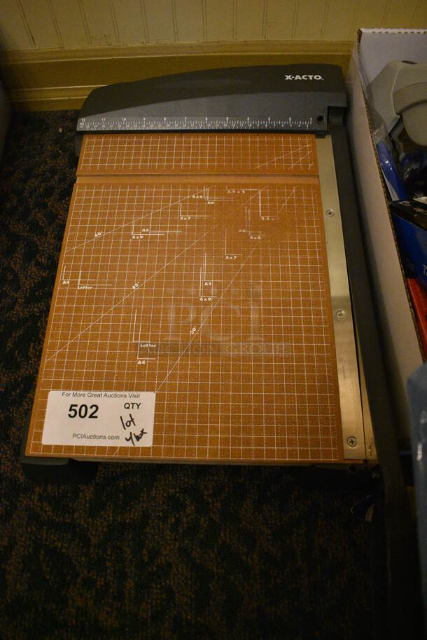 ALL ONE MONEY! Lot of Various Items Including Paper Cutter, Paper, Staplers, Hole Puncher and Tape Dispensers. (main dining room)  - Image 2 of 4