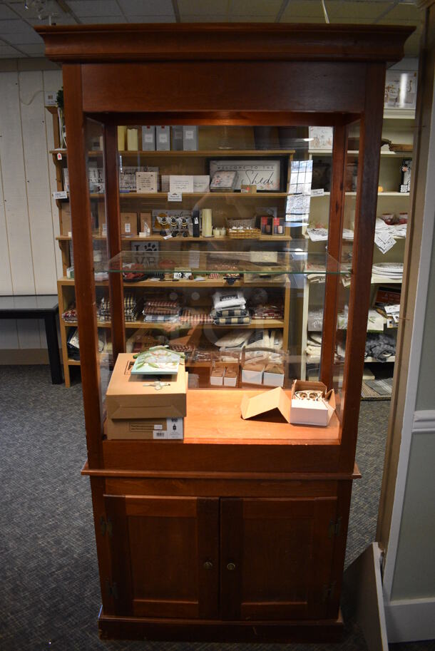 Wooden Cabinet w/ Glass Shelf and 2 Doors. 39x21x80. (garden center)