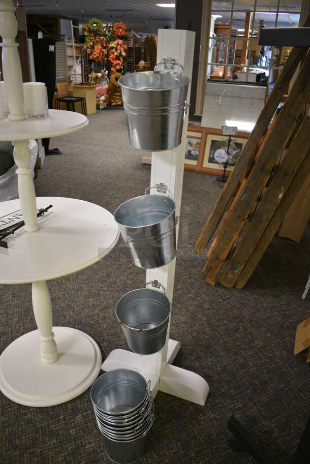 2 Various Stands; White Wooden 2 Tier Round Stand and Stand w/ Metal Buckets. 27x27x61, 19x19x57. 2 Times Your Bid! (garden center) - Image 2 of 3