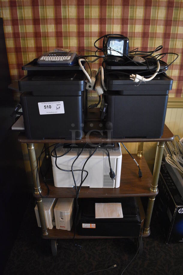 ALL ONE MONEY! Lot of Wood Pattern 3 Tier Cart w/ 4 HP Printers and 2 APC Back Ups on Commercial Casters! 28x16x32. (main dining room) - Image 1 of 6