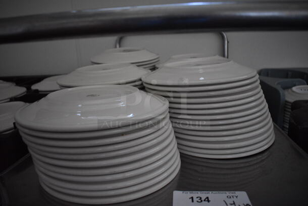 Stainless Steel Commercial 2 Tier Cart w/ Push Handles and Various Ceramic Plates on Commercial Casters. 37x21x40. Includes 9.75x9.75x1. (kitchen hallway) - Image 3 of 5