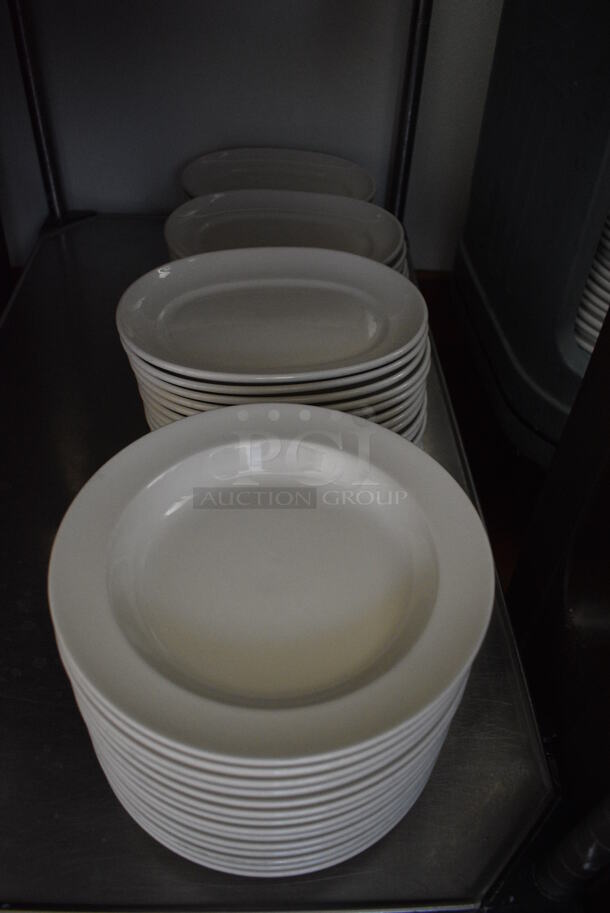 Stainless Steel Commercial 2 Tier Cart w/ Push Handles and Various Ceramic Plates on Commercial Casters. 37x21x40. Includes 9.75x9.75x1. (kitchen hallway) - Image 5 of 5