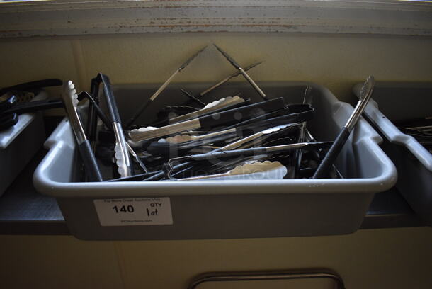 ALL ONE MONEY! Lot of Various Utensils Including Tongs in Gray Bus Bin! 21x15x5. (kitchen hallway) - Image 1 of 3