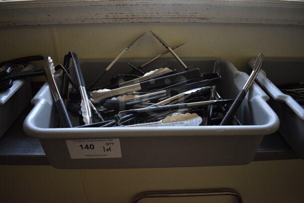 ALL ONE MONEY! Lot of Various Utensils Including Tongs in Gray Bus Bin! 21x15x5. (kitchen hallway)