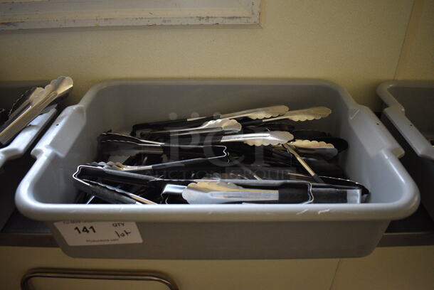 ALL ONE MONEY! Lot of Various Utensils Including Tongs in Gray Bus Bin! 21x15x5. (kitchen hallway)