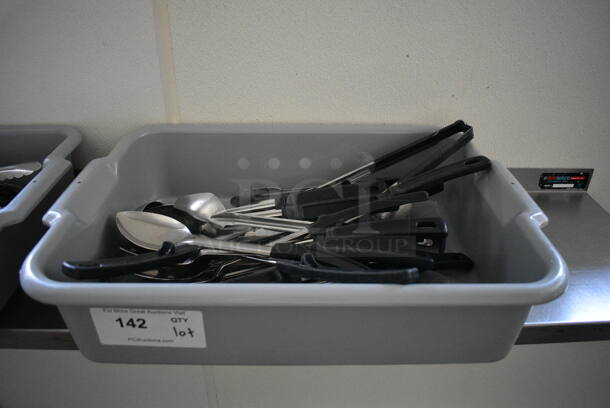 ALL ONE MONEY! Lot of Various Utensils Including Serving Spoons in Gray Bus Bin! 21x15x5. (kitchen hallway) - Image 1 of 5