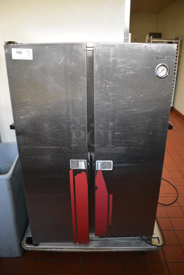 Carter Hoffmann Stainless Steel Commercial 2 Door Heated Holding Cabinet on Commercial Casters. 125 Volts, 1 Phase. 41x30x59. Unit Was In Working Condition When Restaurant Closed. (kitchen hallway)