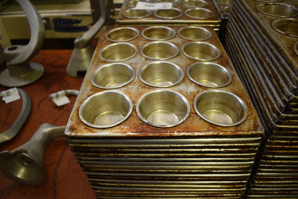 31 Metal 12 Cup Muffin Baking Pans. 10.5x14x1.5. 31 Times Your Bid! (bakery kitchen) - Image 1 of 3