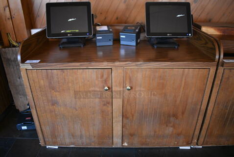 Wooden Counter w/ 2 Doors. Does Not Include Contents. 56.5x31x41.5. (back dining room)