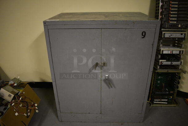 Gray Metal 2 Door Cabinet. 36x24x42. (south basement 012)