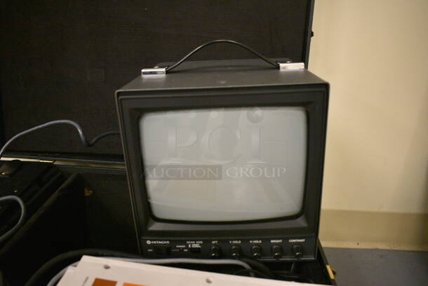Hitachi Monitor in Hard Case. 24x21x11. (south basement 019) - Image 1 of 5