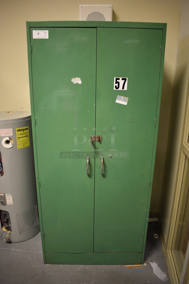 Green Metal 2 Door Cabinet. 36x26x78. (room 102)
