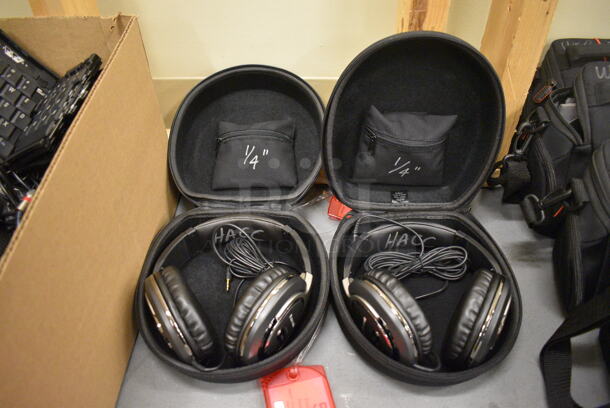 2 Panasonic RP-HTF600 Headphones in Cases. 7.5x8x3.5. 2 Times Your Bid! (south basement 019)