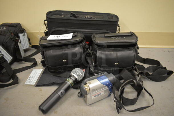 3 Various Bags of Various Items Including JVC Digital Video Camera and Microphone. includes 14x4x9.5, 7.5x4x6. 3 Times Your Bid! (south basement 019)