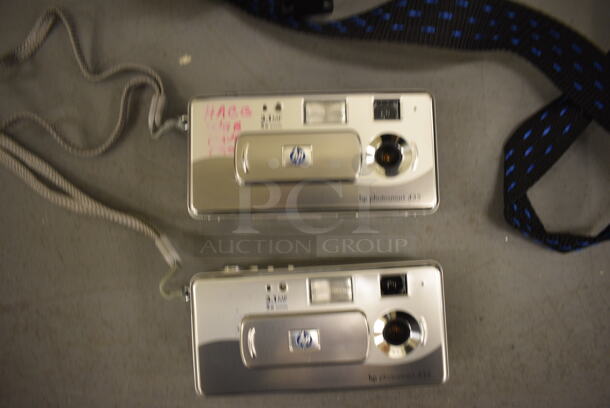 2 HP Digital Cameras in Soft Case. 7x7x3. 2 Times Your Bid! (south basement 019) - Image 2 of 3
