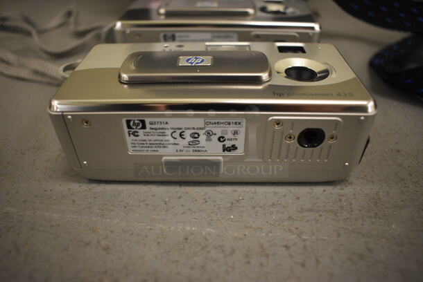 2 HP Digital Cameras in Soft Case. 7x7x3. 2 Times Your Bid! (south basement 019) - Image 3 of 3