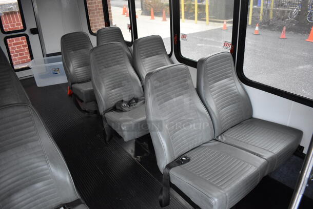 2015 Ford Bus w/ 14 Individual Passenger Seats. Odometer Reads 36,679.9. VIN 1FDEE3FS0FDA17475. Title In Hand. Vehicle Needs a New Transmission; Comes w/ Inoperable Transmission. Vehicle Will Need To Be Towed. See Lot #4 For Additional Pictures. - Image 8 of 12