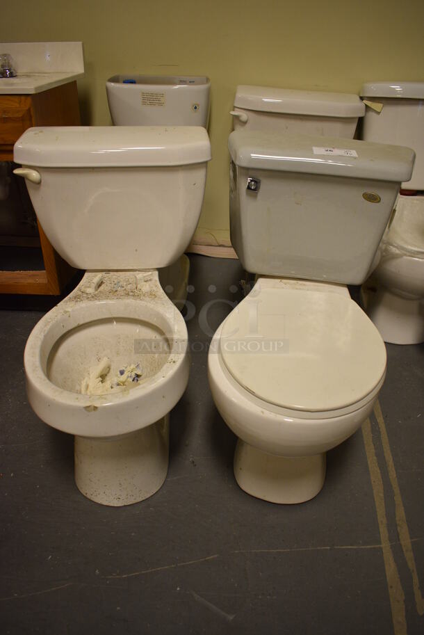 4 Various White Toilets; 2 Missing Toilet Seat and Lid and 1 Missing Tank Cover. Includes 19x28x29. 4 Times Your Bid! (room 102)