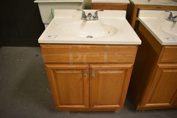Bathroom Sink w/ Faucet, Handles and 2 Wood Pattern Doors. 25x19x34. (room 102)