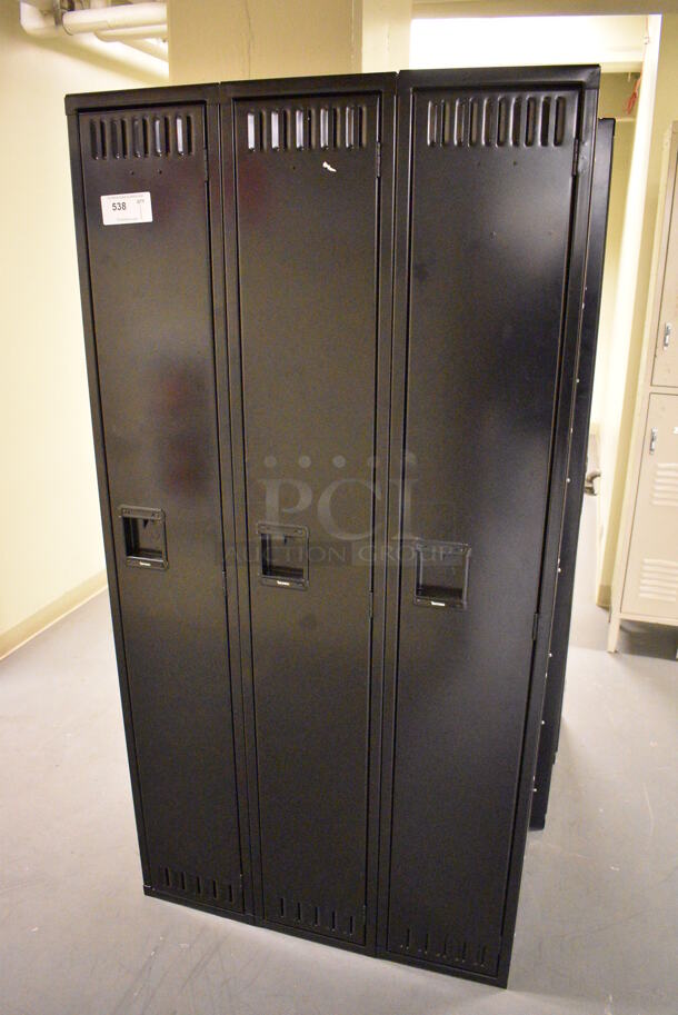 Black Metal 3 Cubby Locker. 36x18x72. (north basement hallway)