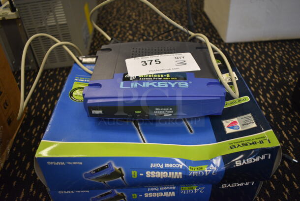 3 Linksys Wireless G Access Point. 7.5x7.5x2. 3 Times Your Bid! (room 204)