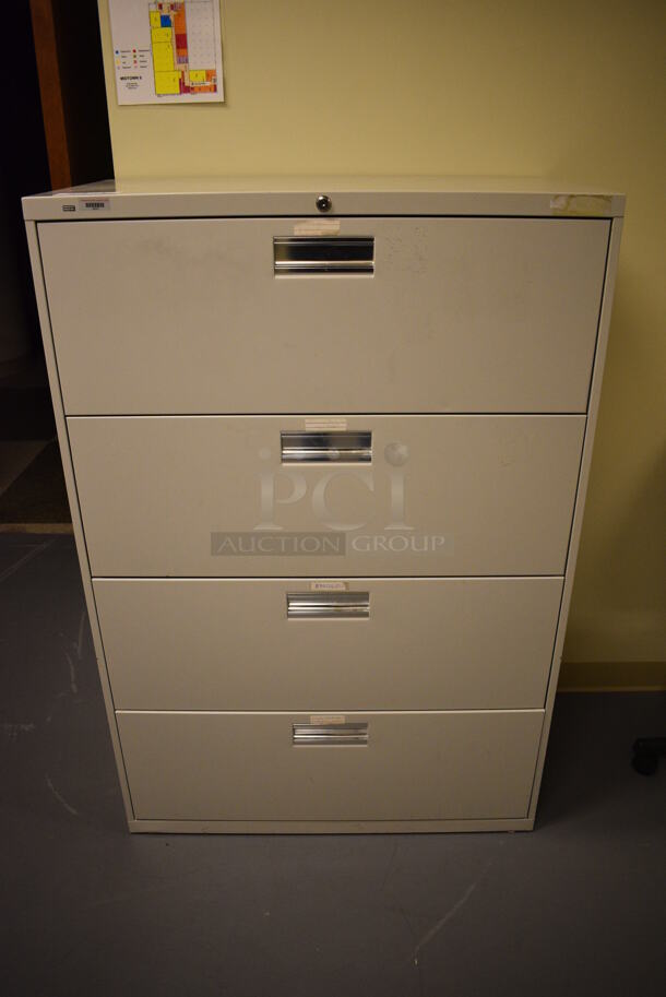Tan Metal 4 Drawer Filing Cabinet. 36x19x53. (south basement hallway by 022)