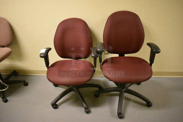 2 Red Office Chairs w/ Arm Rests on Casters. 24x22x39. 2 Times Your Bid! (south basement hallway by 022)