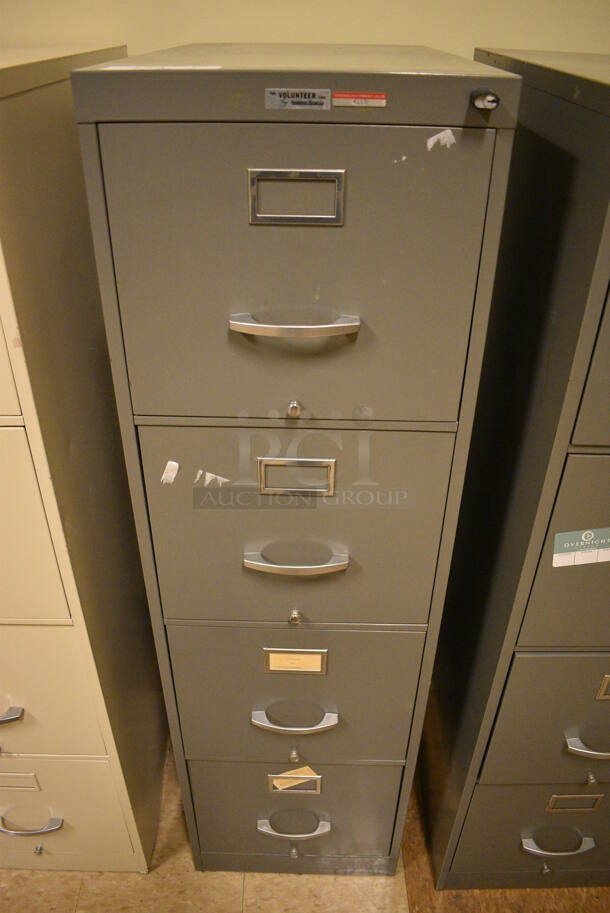 Gray Metal 4 Drawer Filing Cabinet. 15x24x52. (room 108a)
