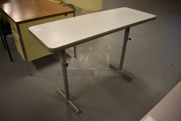 Gray Table. 48x18x33. (south basement 017)