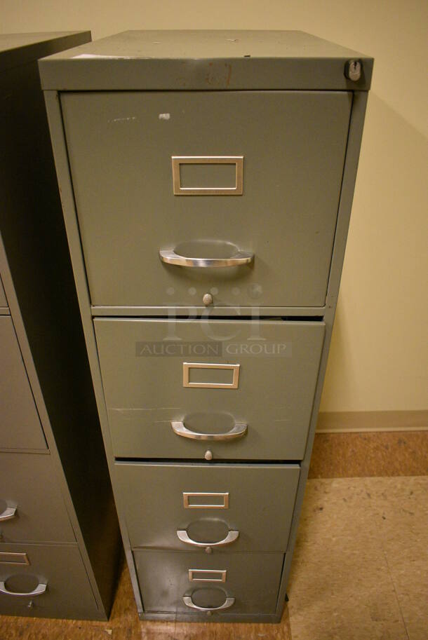 Gray Metal 4 Drawer Filing Cabinet. 15x24x52. (room 108a)