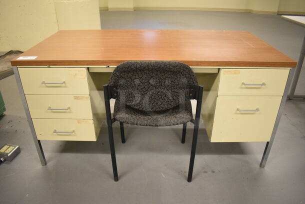 Tan Metal Desk w/ 5 Drawers and Wood Pattern Desk Top. Comes w/ Black Chair. 60x30x29, 19x17x32. (south basement 017)