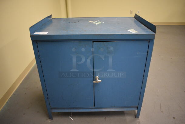 Blue Metal 2 Door Cabinet. 36x25x37. (south basement 017) - Image 1 of 4