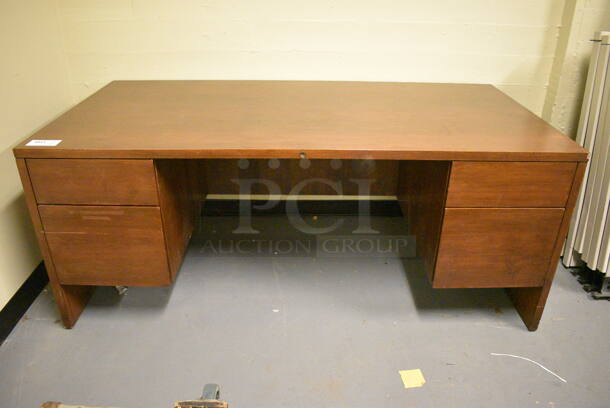 Wooden Desk w/ 4 Drawers. 72x36x30. (south basement 024)