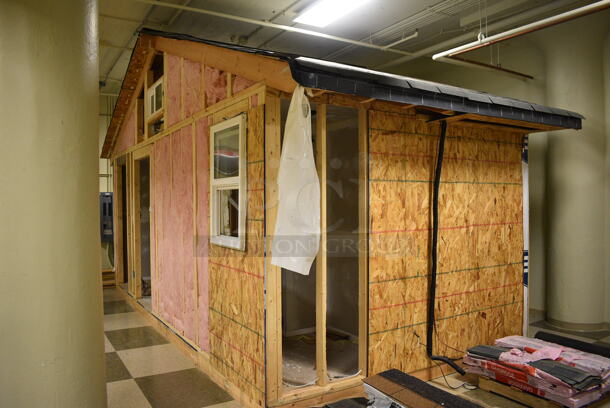Wooden Small Demo House Frame w/ Insulation, Windows, Ruud Unit, Square D Switch. BUYER MUST REMOVE: Winning Bidder Will Have To Contact HACC To Make an Appointment To Remove This Item Between May 6th and May 13th. 24'X12'X12.5'. (room 103) - Image 11 of 12
