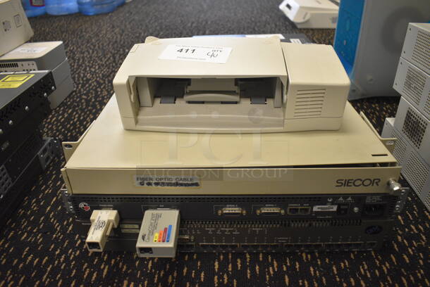 4 Various Items; Printer, Siecor Fiber Optic, Cisco Systems Unit and IBM. Includes 13x9x4.5. 4 Times Your Bid! (room 204)