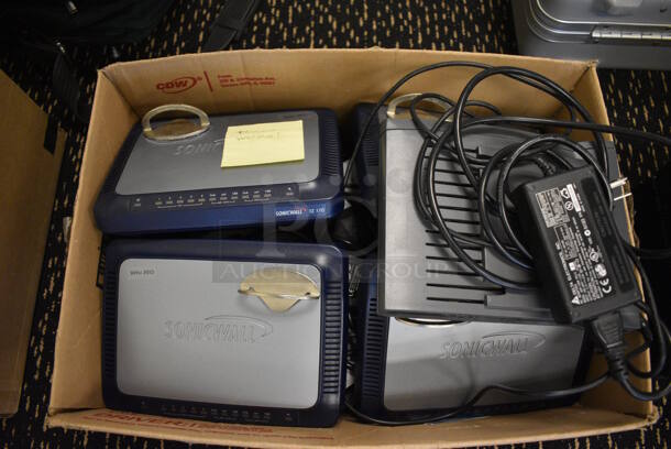 7 Various Items Including Sonicwall Units. Includes 9x6.5x1.5. 7 Times Your Bid! (room 204)