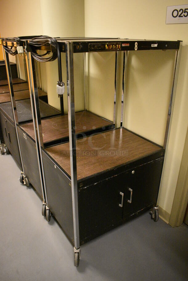 2 Metal AV Cart on Commercial Casters. 31x23x54, 31x20x54. 2 Times Your Bid!  (south basement hallway by 022)