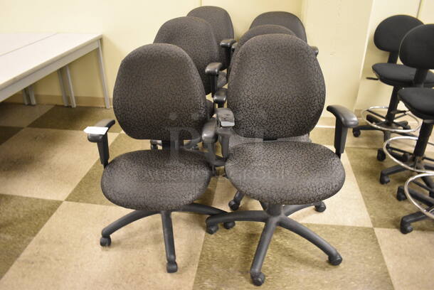 6 Black Patterned Office Chairs on Casters. 23x21x39. 6 Times Your Bid! (north basement 004b)