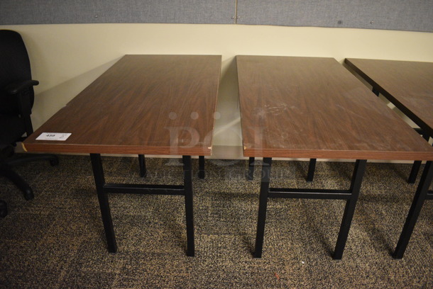 2 Wood Pattern Tables. 47.5x23.5x29. 2 Times Your Bid! (room 211)