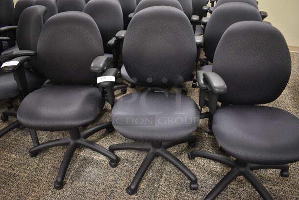 10 Office Chairs w/ Arm Rests on Casters. 24x22x39. 10 Times Your Bid! (room 215)