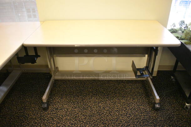 5 Wood Pattern Tables on Casters. 60x30x36. 5 Times Your Bid! (room 220)